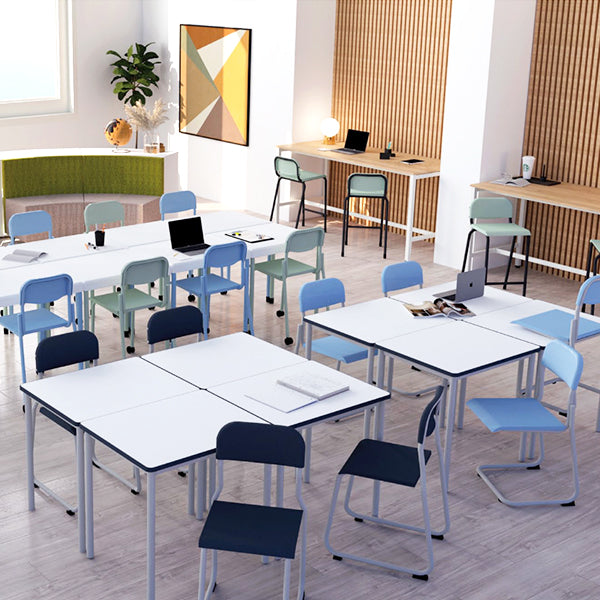 Mais Chair and Table Range Lifestyle Modern classroom with tables, chairs, and laptops in a bright setting